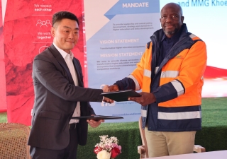 Permanent Secretary, Ministry of Higher Education Prof. Richard Tabulawa (R) and The acting President - Africa Operations and Director- Finance, MMG, Khoemacau, Mr Wei Gao (L) after signing the MOU.  